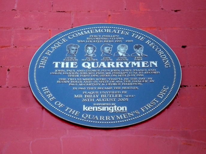 This plaque commemorates the recording here of The Quarrymen's first disc. Percy Phillips recording studio was located here 1955-1969. The Quarrymen. John, Paul and George plus John Lowe (piano) and Colin Hanton (drums) paid Mr Phillips 17 /6 to record their first disc here on 17th July 1959. The two numbers were "That'll Be The Day" by Buddy Holly and "In Spite Of All The Danger" by Paul McCartney & George Harrison. In 1960 they became The Beatles.